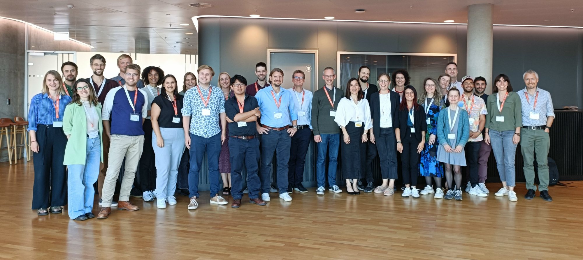 Current and former Olsen Group members at a symposium in 2023
